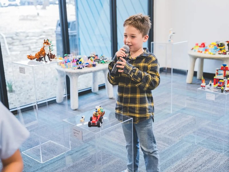 Alpha student presenting at a campus showcase
